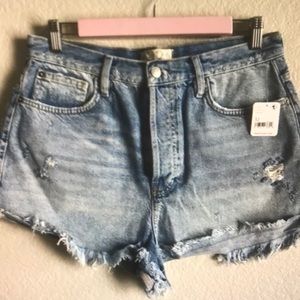 Free people light wash distressed denim shorts